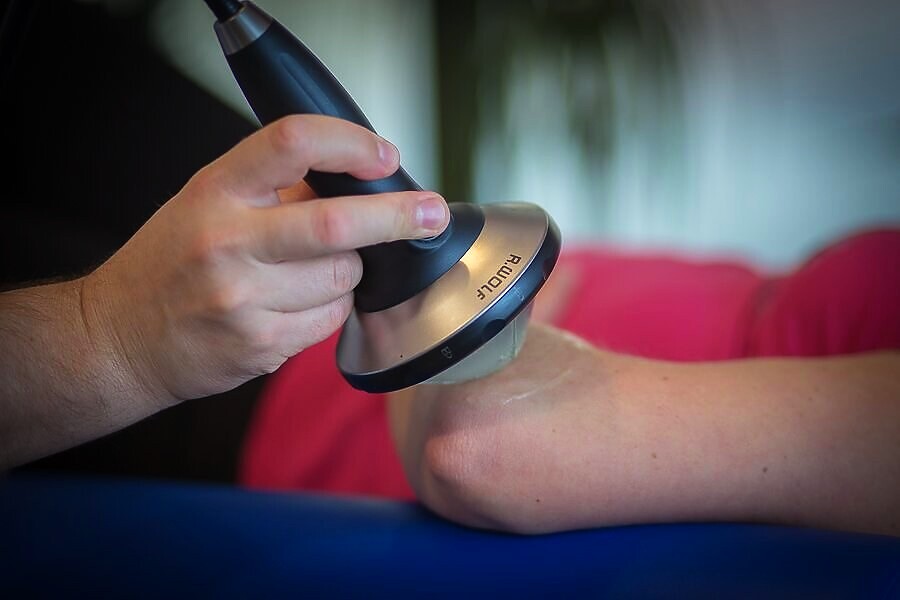Zabieg skupioną falą uderzeniową na łokieć tenisisty — Rehios, Warszawa Mokotów